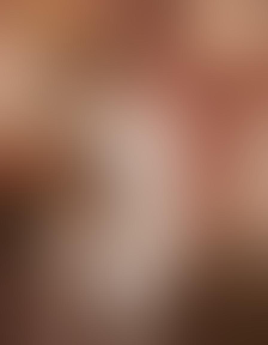 A luxurious boutique showcasing a variety of sophisticated intimate apparel, featuring lace, silk, and satin textures in elegant colors. The scene includes soft, ambient lighting to enhance the opulence, with mannequins elegantly displaying delicate lingerie sets. Floral elements and plush textiles create a warm and inviting atmosphere, emphasizing sophistication and glamour. ultra-realistic. vibrant colors. soft focus.